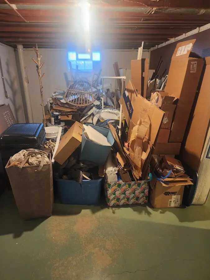 Roll-off dumpster container at job site for Concrete Dumpster Rental in Maine